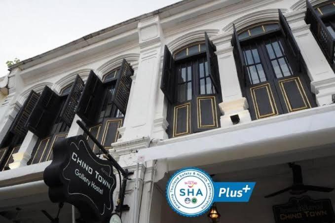 a building with a pub sign in front of it at Chino Town at Yaowarat Phuket - SHA Plus in Phuket