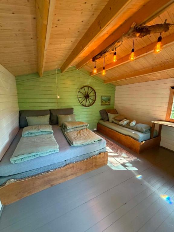 a bedroom with two beds in a room at opplevelses hytta badestamp ridning osv in Skien