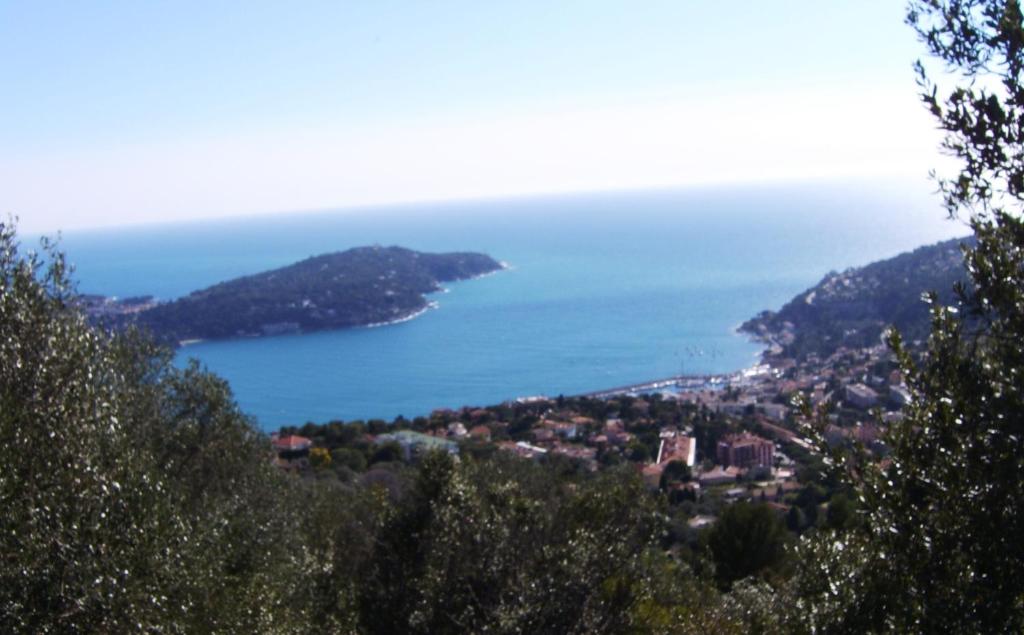 a view of a city and the ocean at Les lilas blancs in Villefranche-sur-Mer
