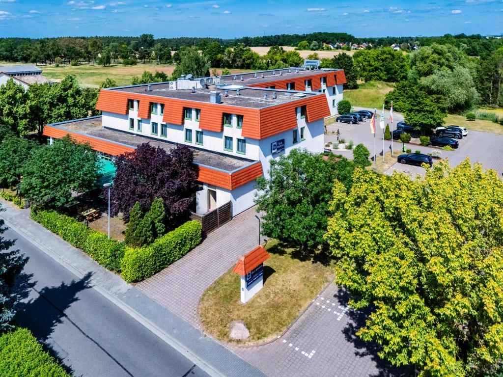 an overhead view of a building with an orange roof at Best Western Spreewald in Lübbenau