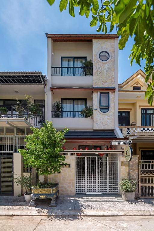a building with a clock on top of it at RubyHome in Thôn Nguyệt Biều