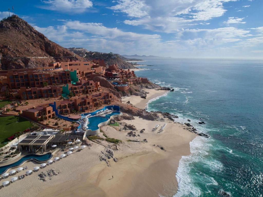 an aerial view of a beach and the ocean at Club Regina Los Cabos in San José del Cabo