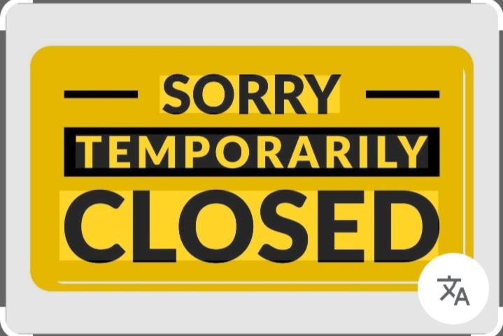 a yellow sign with the words sorry temporarily closed at Casa dos Sonhos Glamping in Lagoa