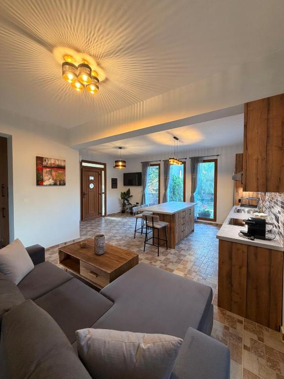 a living room with a couch and a table at Terra Kampos Chios in Chios