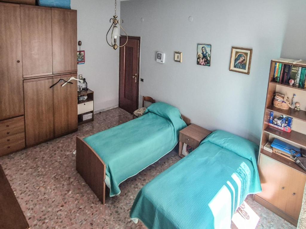 a hospital room with two beds and a cabinet at DeLiA in Avellino
