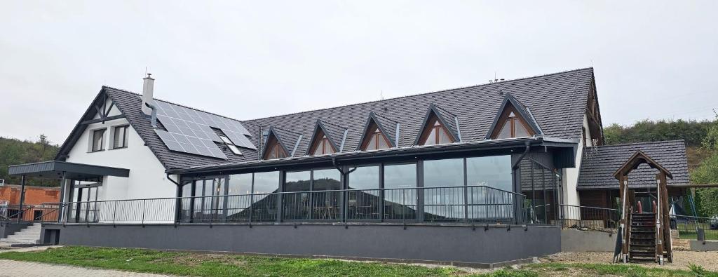 a house with a roof with a lot of windows at Nidum - Šariš Park Hotel & Wellness in Prešov