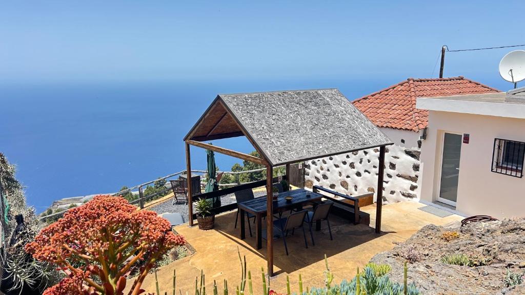 a gazebo on the patio of a house at Casa Maruca in Puntagorda
