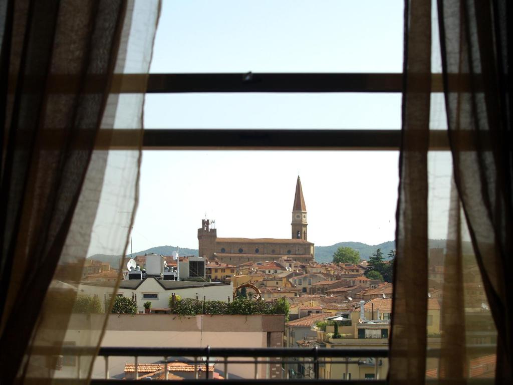a view of a city from a window at B&B Cameracaffè Centro in Arezzo