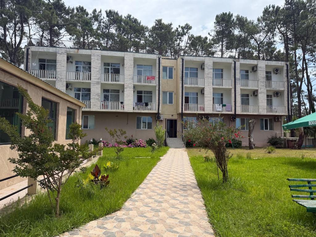 a large building with a pathway in front of it at LizAna in Shekhvetili