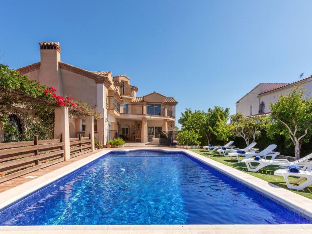 a villa with a swimming pool and a house at Villa Villa Cantos by Interhome in L'Ametlla de Mar