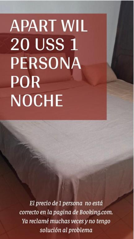 a poster of a bed in a room with avertisement at Apart Wilma in Encarnación