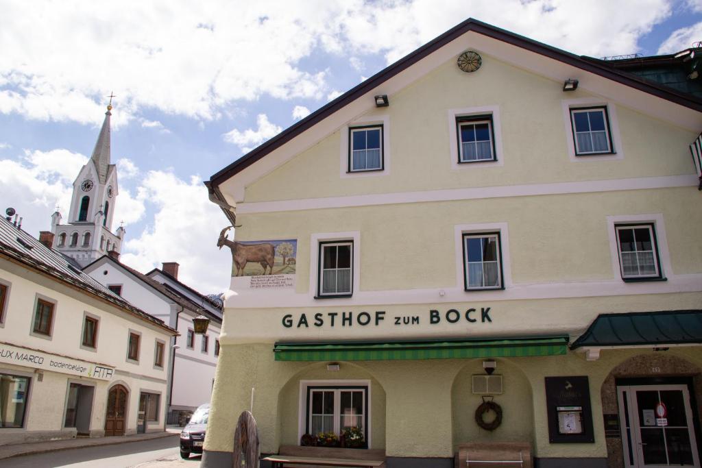a building on a street with a church at Bockwirt in Schladming