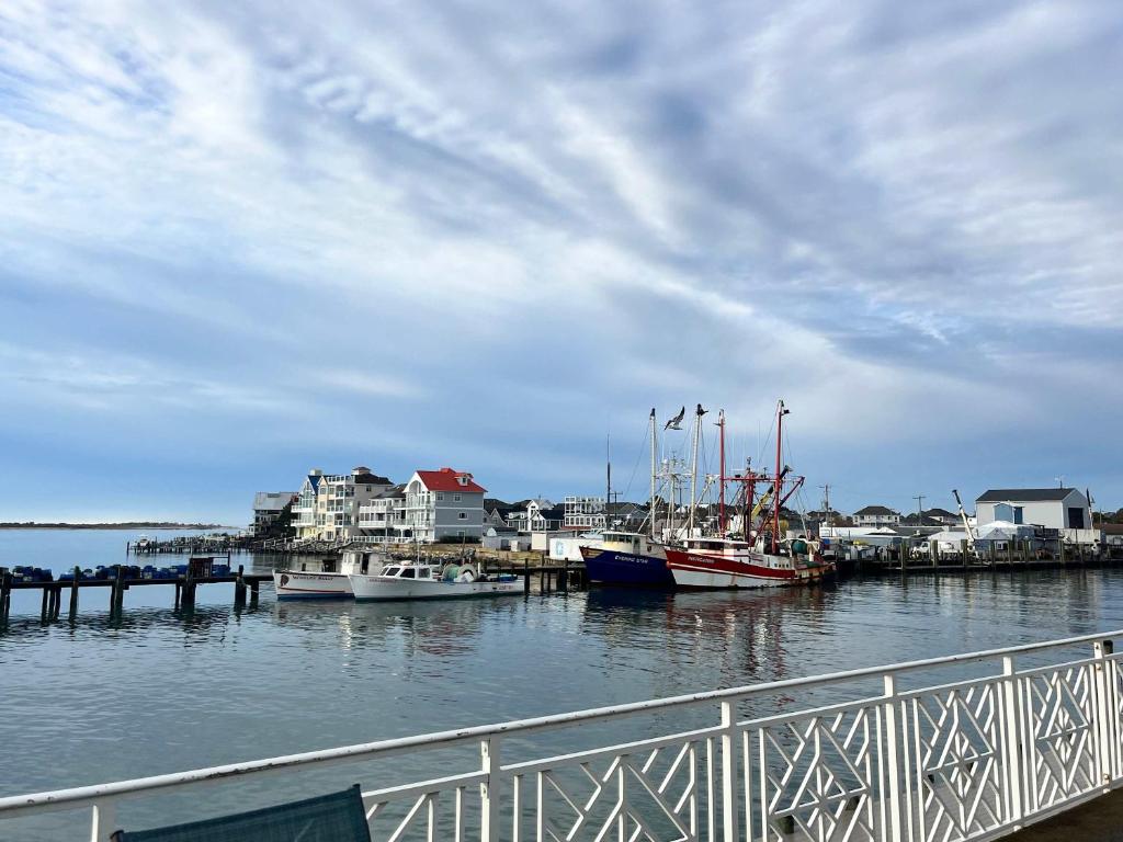 a group of boats docked at a dock on the water at Sunset Getaway in Ocean City