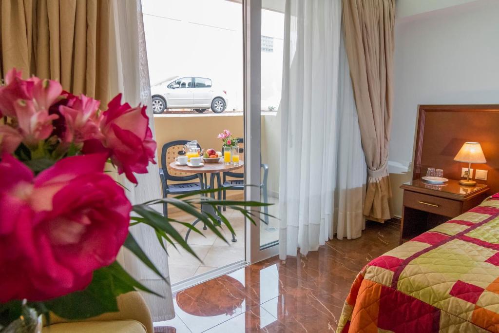 Postel nebo postele na pokoji v ubytování Porto Alegre Hotel