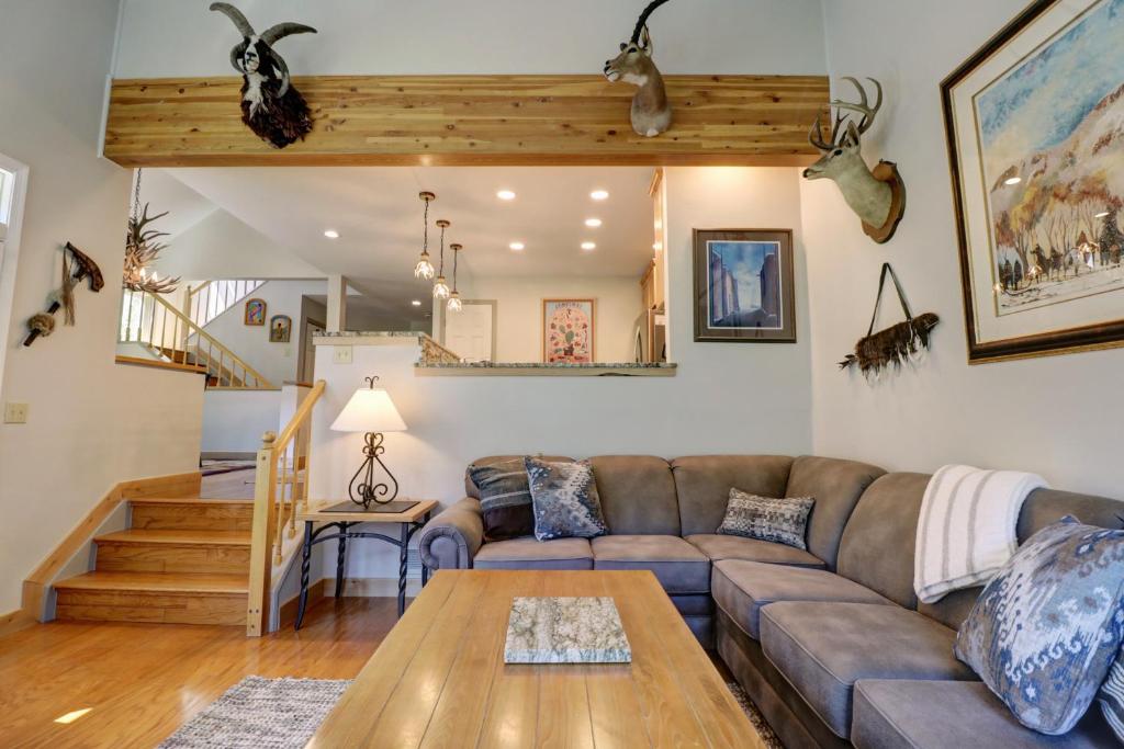 a living room with a couch and a table at Woods 21 Townhome in Copper Mountain