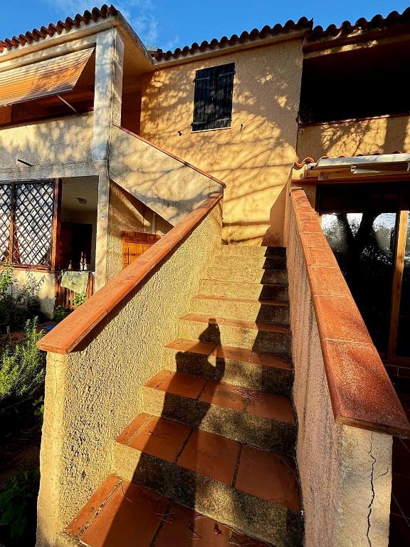 a set of stairs leading to a house at Casa Pineta in Rena Majore