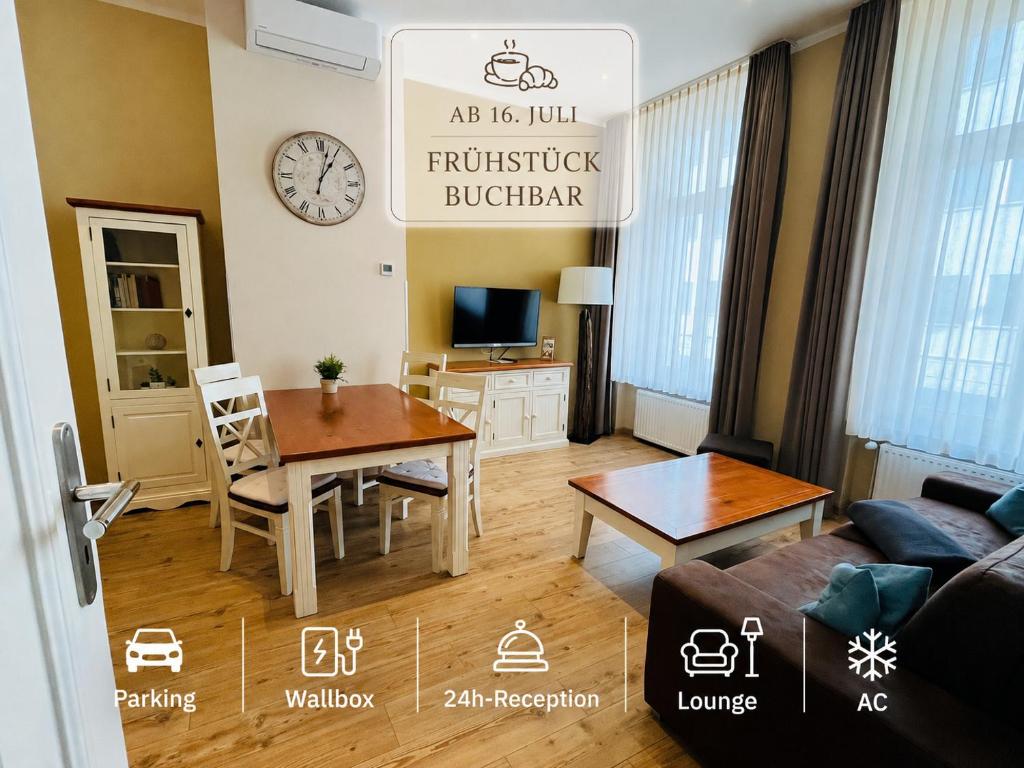 a living room with a table and a couch at Apartment Central Leipzig-Zoo in Leipzig