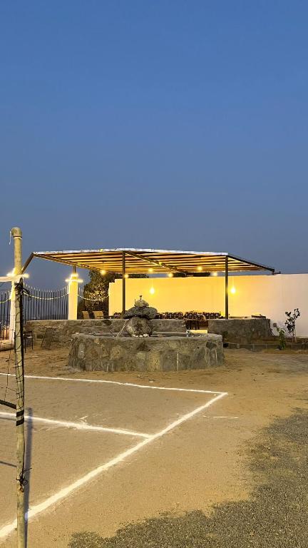 an empty parking lot with a gas station at The Mountain View in Al Namas in Al Namas