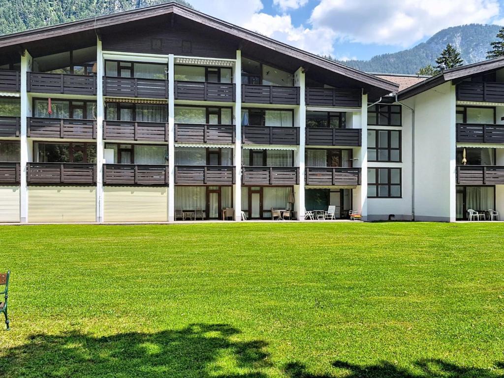 a large building with a lawn in front of it at Apartment Grubhof by Interhome in Scheffsnoth