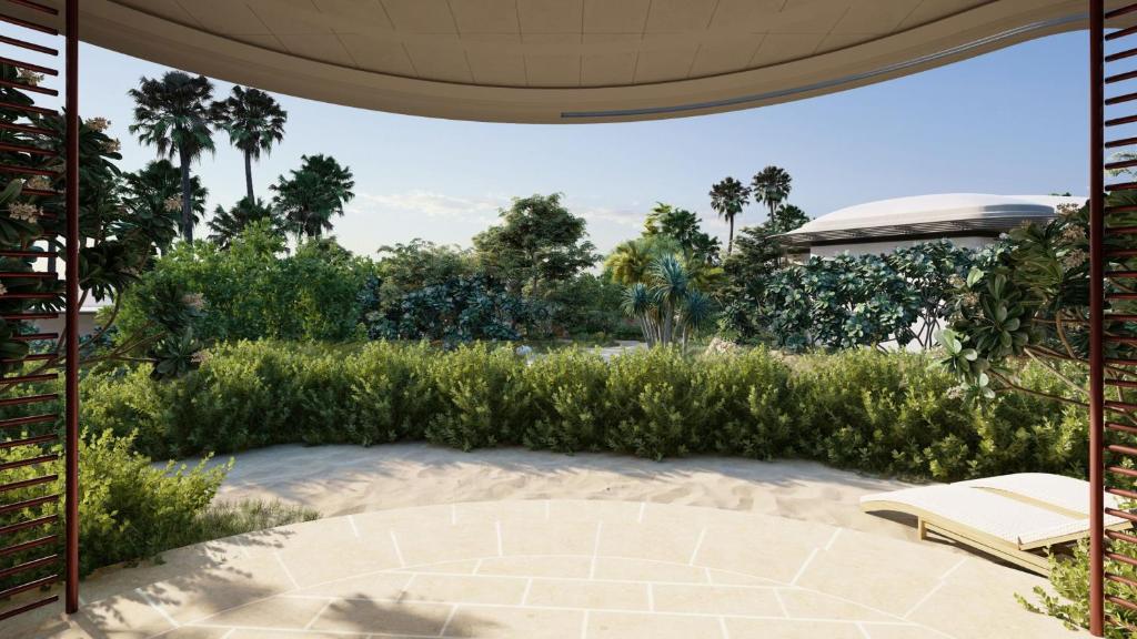 a patio with a chair and an umbrella at InterContinental The Red Sea Resort by IHG in Ḩanak