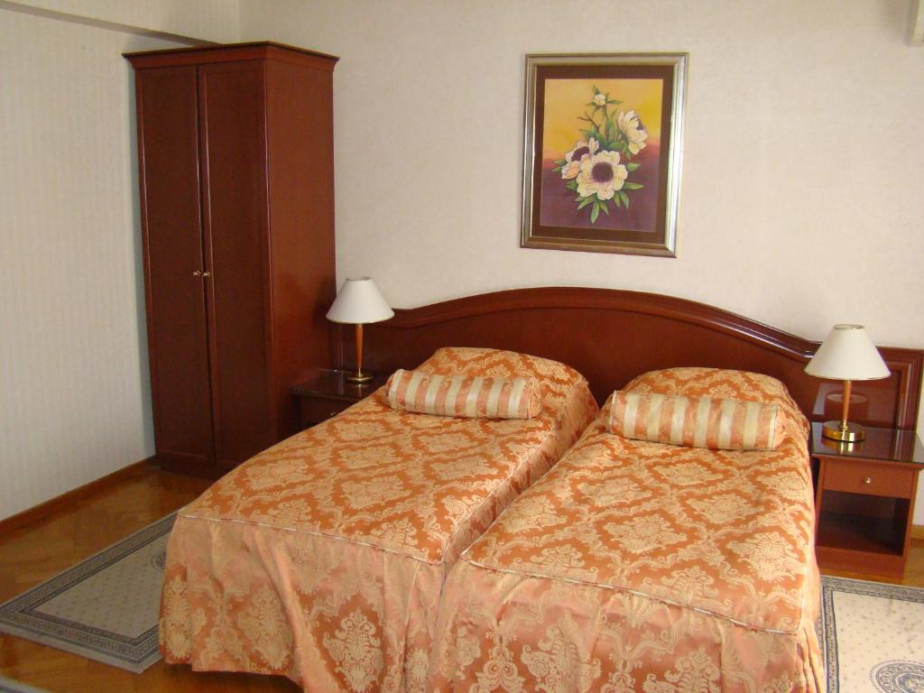 Postel nebo postele na pokoji v ubytování Hotel Vila Ariston
