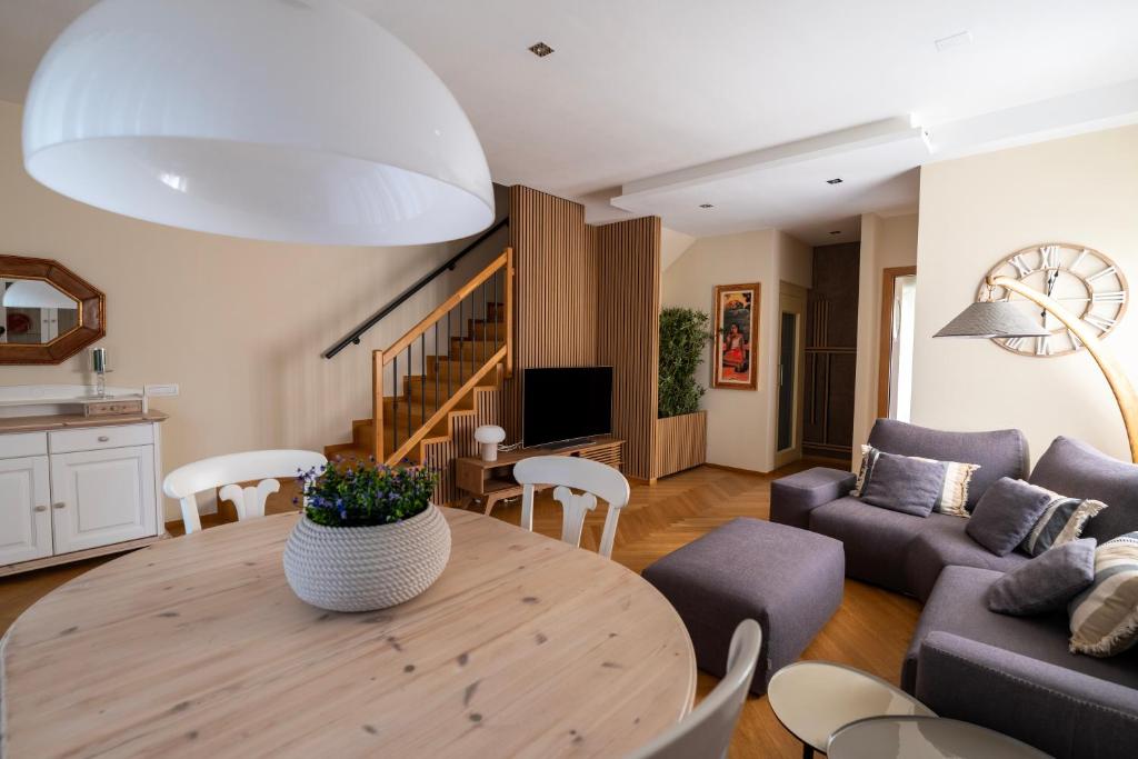 a living room with a table and a couch at ReDavid House Villa in Torre a Mare