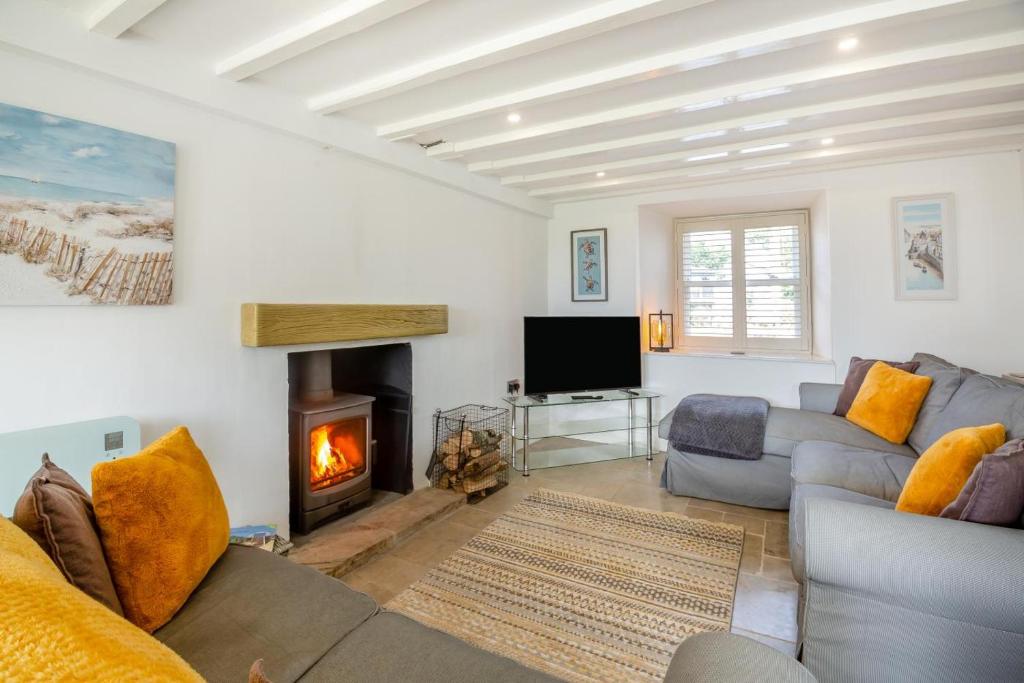 a living room with a couch and a fireplace at 2 Bed in Llanfair oc-a30451 in Llanfair