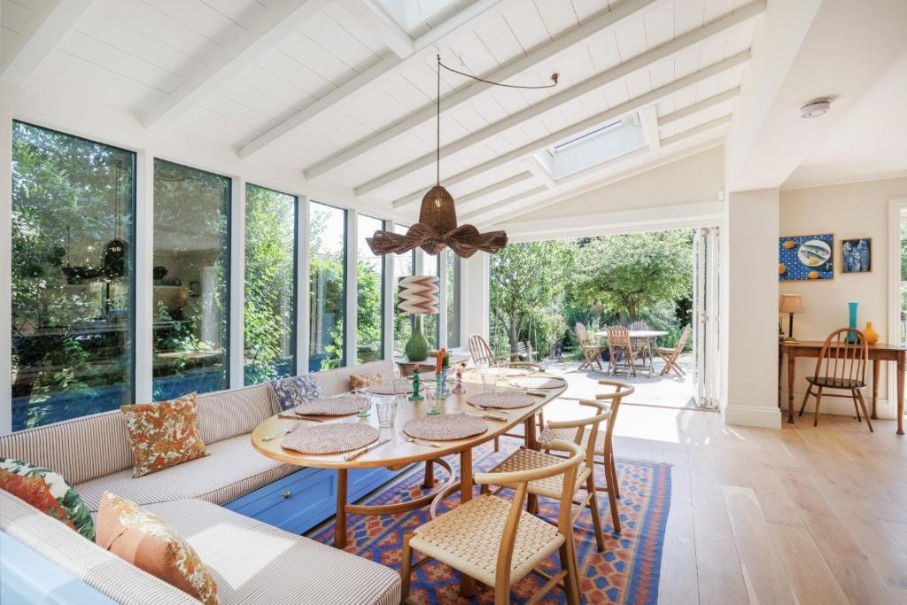 a dining room with a table and chairs at Sandown, Spacious and Stylish in Southwold in Southwold