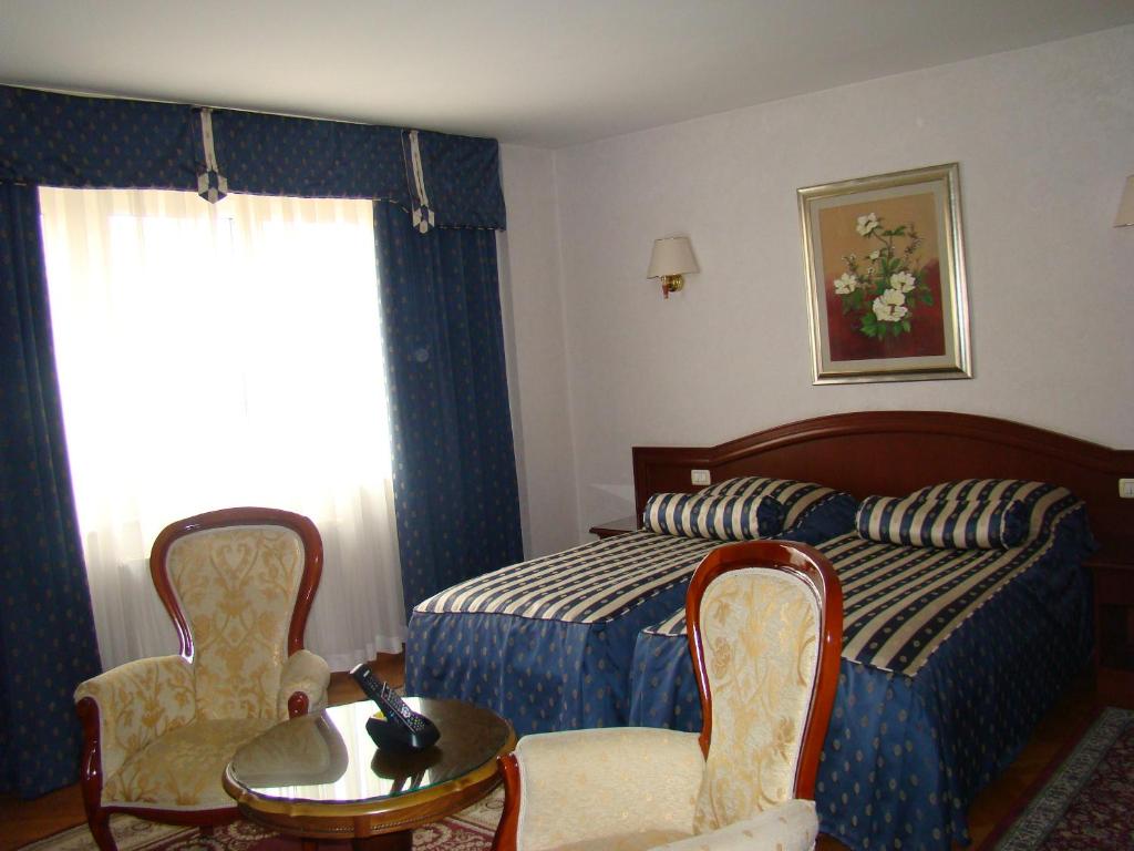 Posteľ alebo postele v izbe v ubytovaní Hotel Vila Ariston