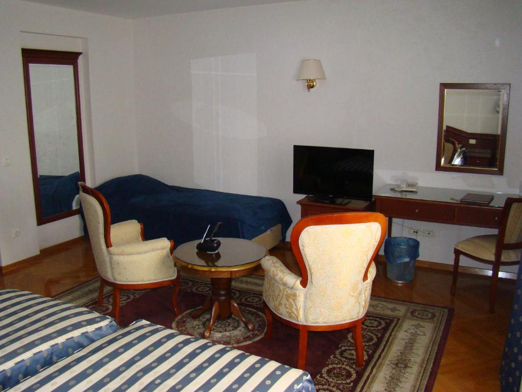 TV a/nebo společenská místnost v ubytování Hotel Vila Ariston