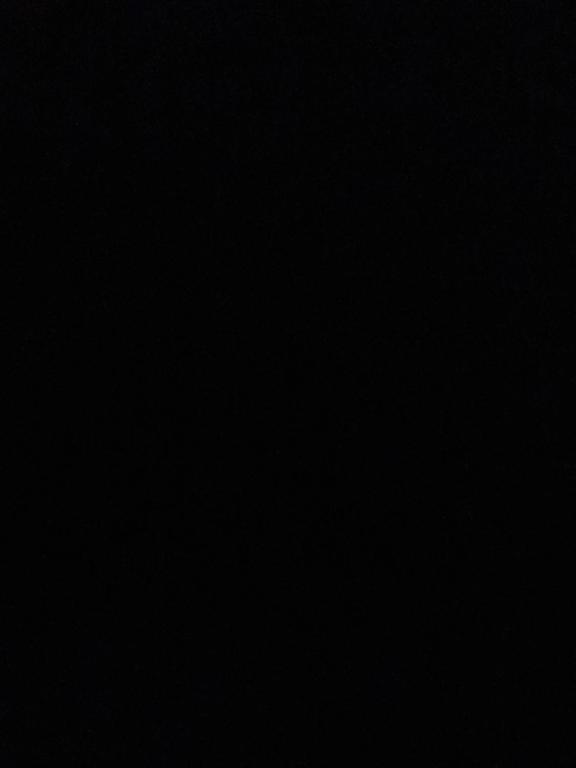 a dark room with a black background at Rum lora in Disah