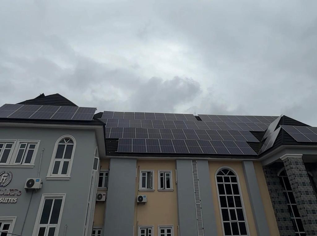 a building with solar panels on the roof at FOURTOWERShotel in Ijoko Lemode