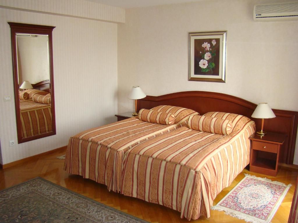 Postel nebo postele na pokoji v ubytování Hotel Vila Ariston