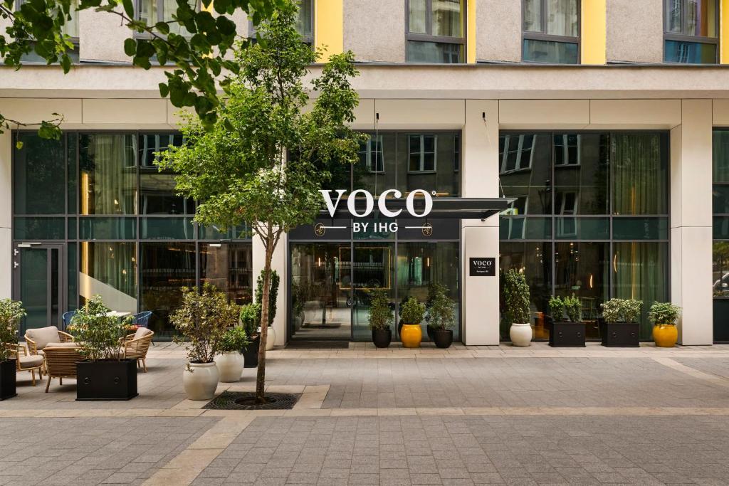 a building with a yoga sign in front of it at voco Budapest D8 by IHG in Budapest