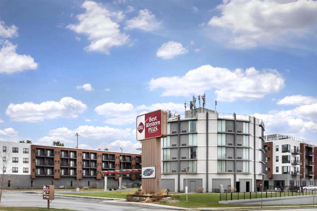 a building with a sign on the side of it at Best Western Plus Wausau Tower Inn in Wausau