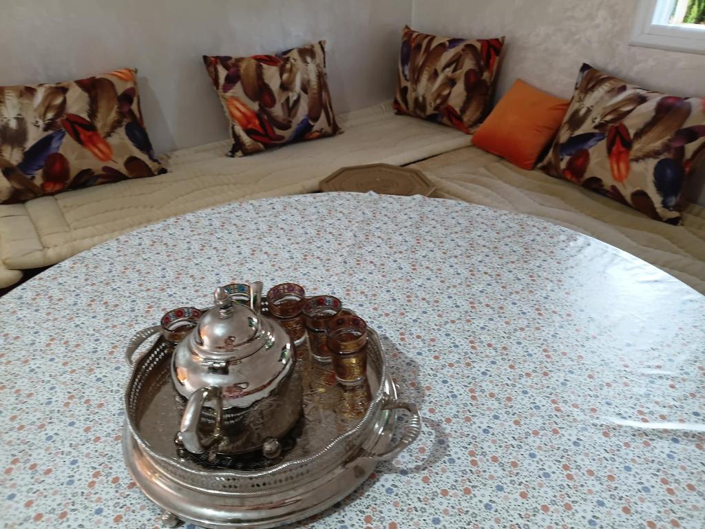 a table with a tea pot on top of it at house dream in Berkane