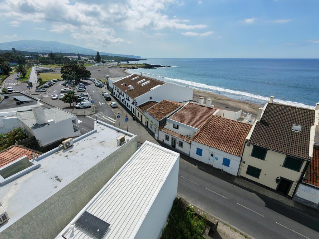 an aerial view of a city and the ocean at Casa do Mar South in Ponta Delgada