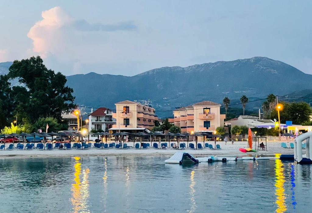a view of a beach with buildings and the water at Akroyiali Resort in Vasiliki