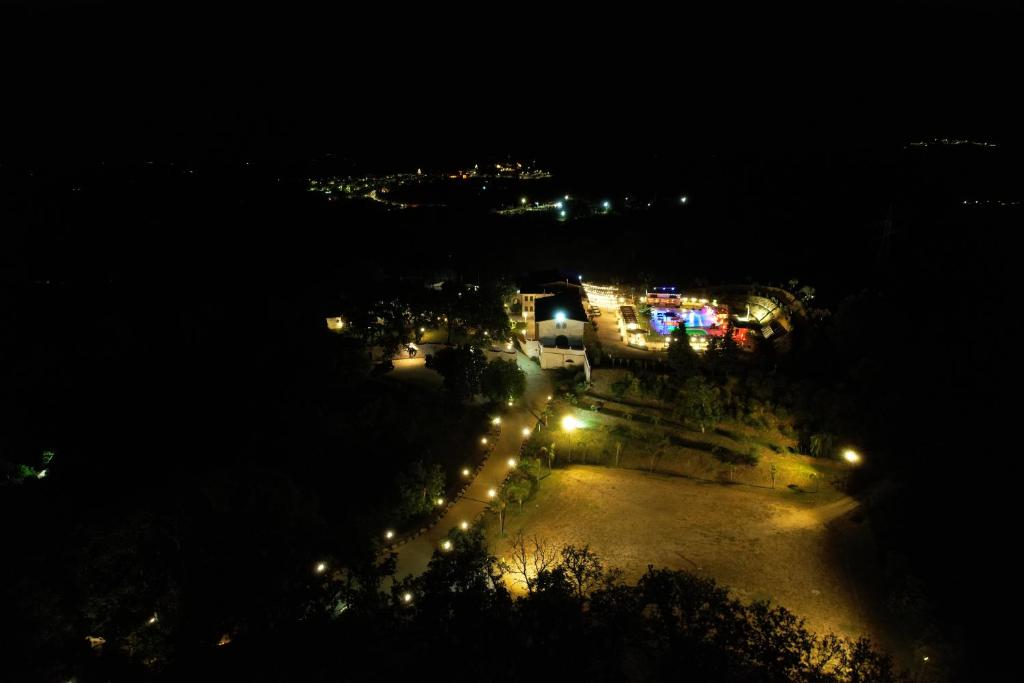 an overhead view of a city at night with lights at Tenuta Lunoa in Salandra