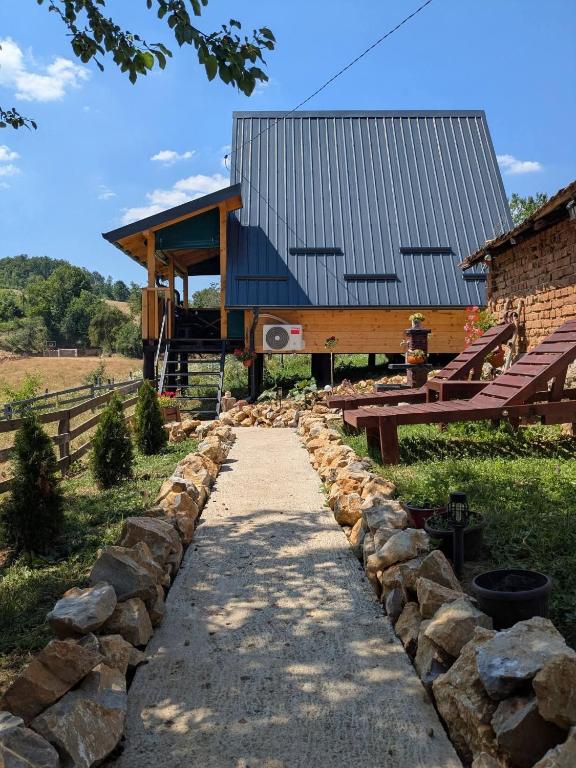 a stone path in front of a building at Prenoćište Lelić in Valjevo