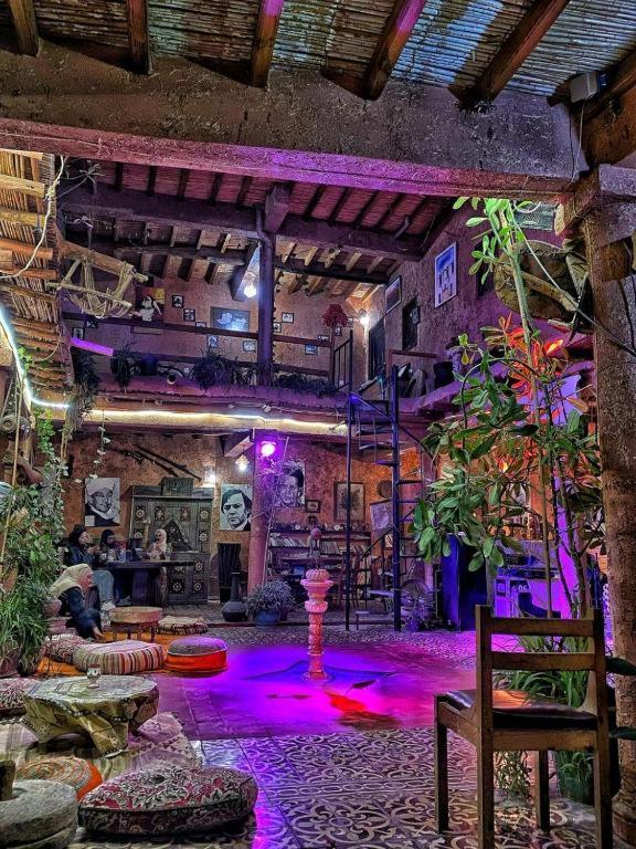a large room with purple lights on the floor at Riad Espace Asrir Tiznit in Tiznit