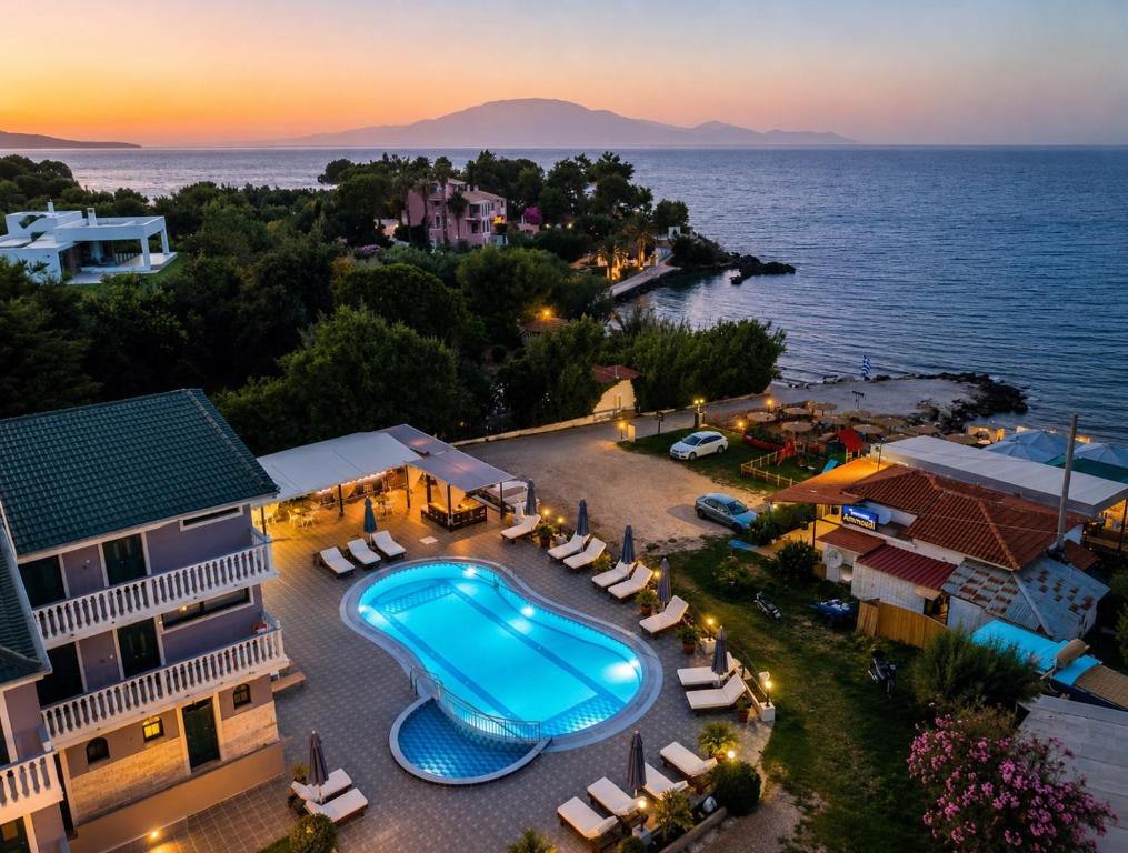 an aerial view of a resort with a swimming pool at Amarylis Beachfront Studios in Amoudi