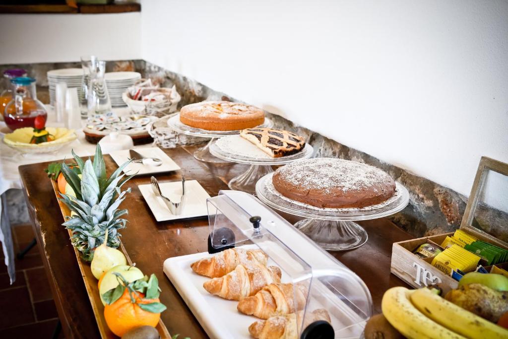 a table with many different types of food on it at Agriturismo Ristorante Monte Argentario in Monte Argentario