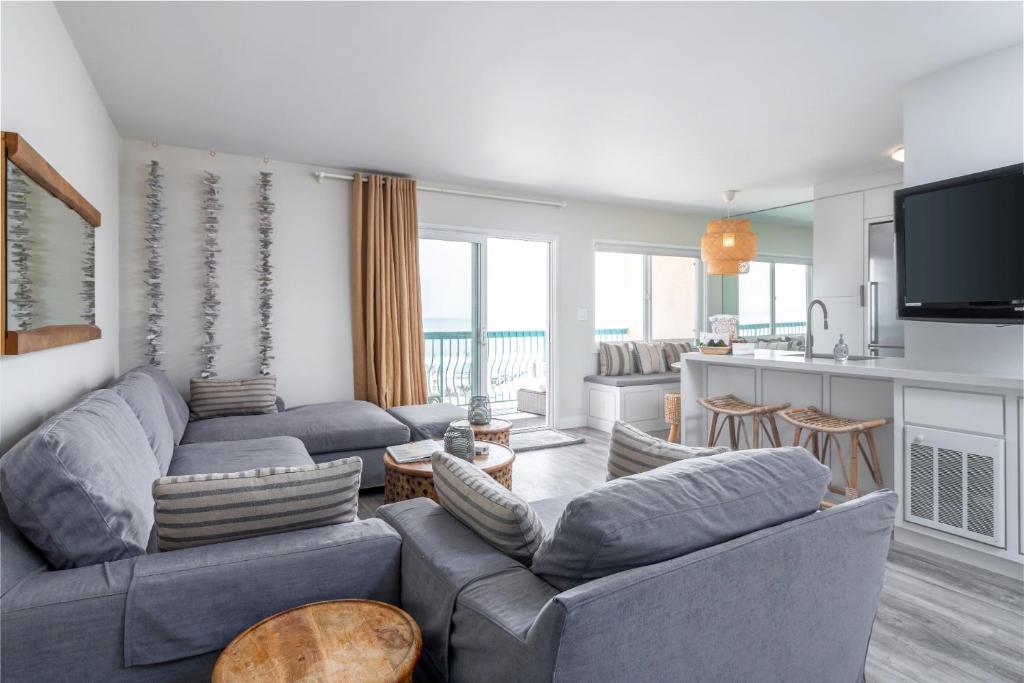 a living room with two couches and a kitchen at Carpinteria Shores CS 312 in Carpinteria