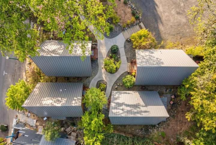 an overhead view of a group of buildings with trees at Artbliss Hotel in Stevenson