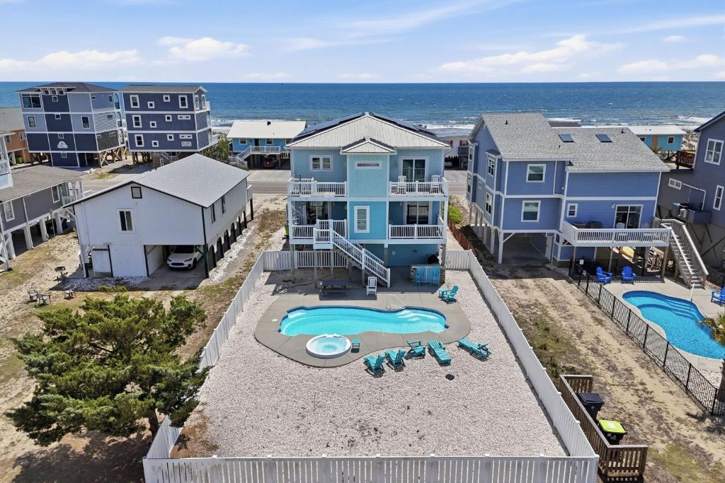 an aerial view of a house with a swimming pool at Wait N Sea by Oak Island Accommodations in Oak Island