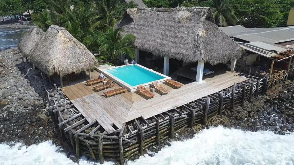 an aerial view of a resort with a swimming pool at Hostal Punta El Zonte in El Zonte