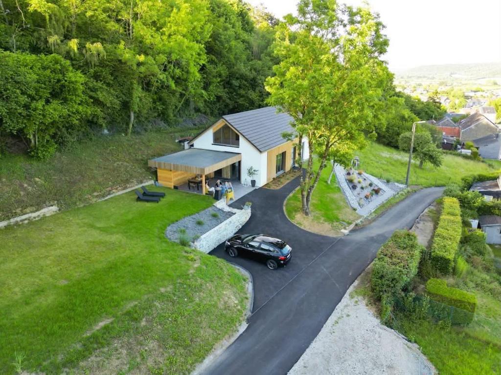 an aerial view of a house with a car on a road at Gîte Chalet Bellevue in Couvin