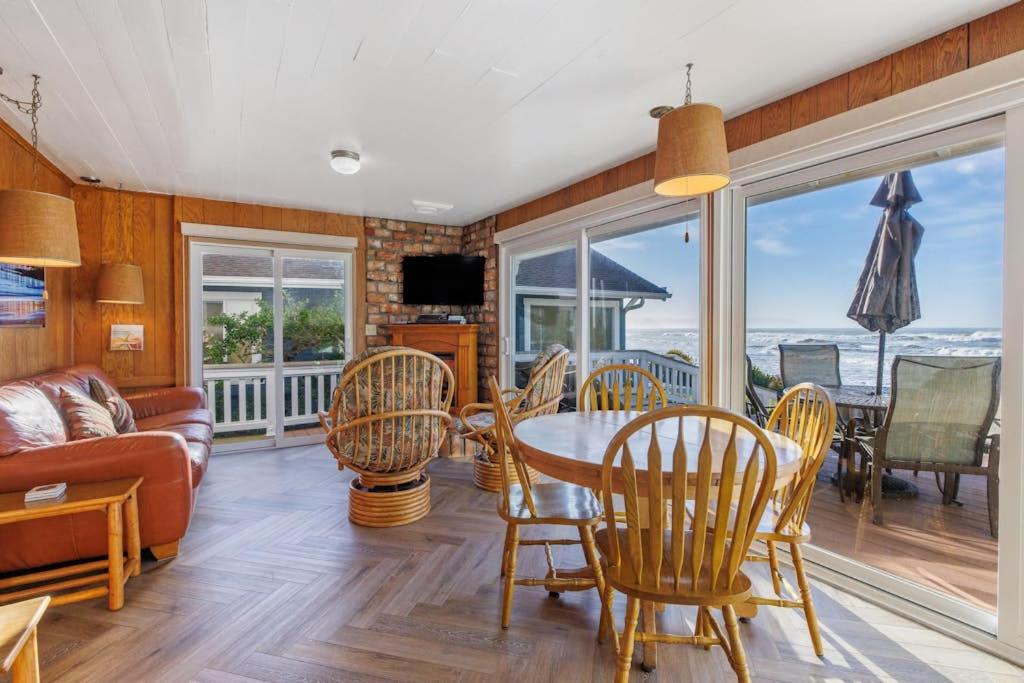 a living room with a table and chairs at Coastal Coziness in Cayucos