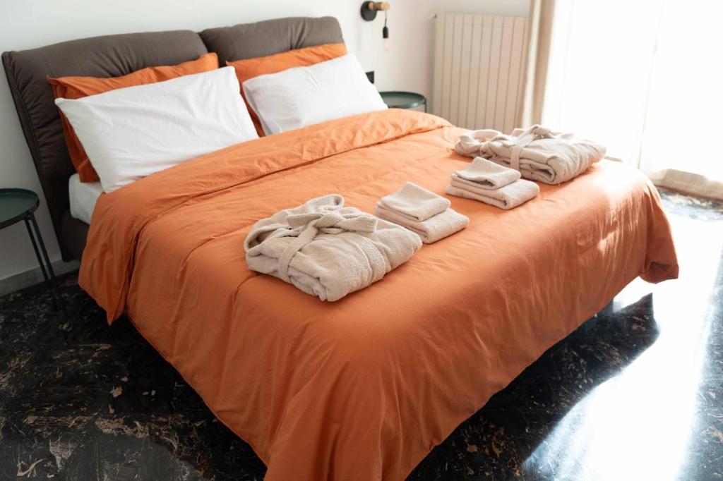 a bedroom with a bed with towels on it at Brighella in Putignano